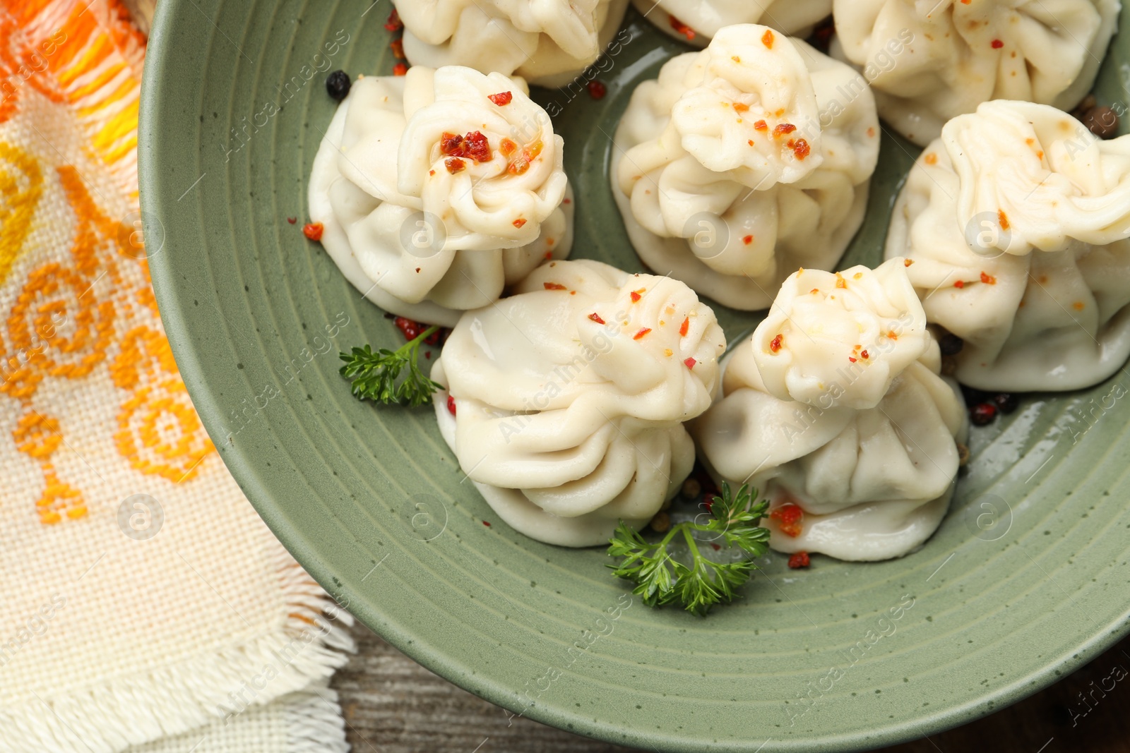 Delicious khinkali with spices on table, top view Photo of Delicious khinkali with spices on table, top view