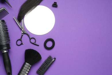 Photo of Different hairdresser's tools on purple background, flat lay. Space for text