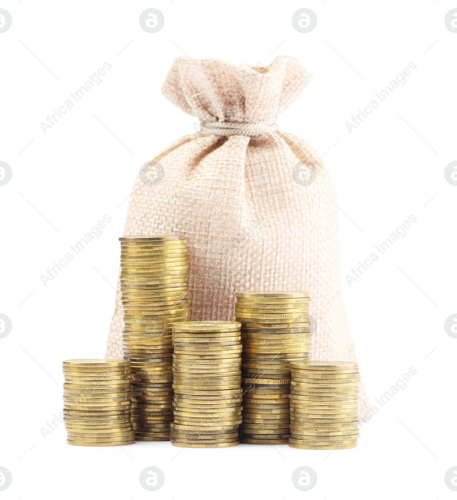Bag and stacked coins isolated on white Photo of Bag and stacked coins isolated on white