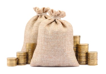 Photo of Bags and stacked coins isolated on white