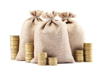 Photo of Bags and stacked coins isolated on white