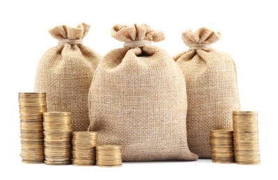 Photo of Bags and stacked coins isolated on white