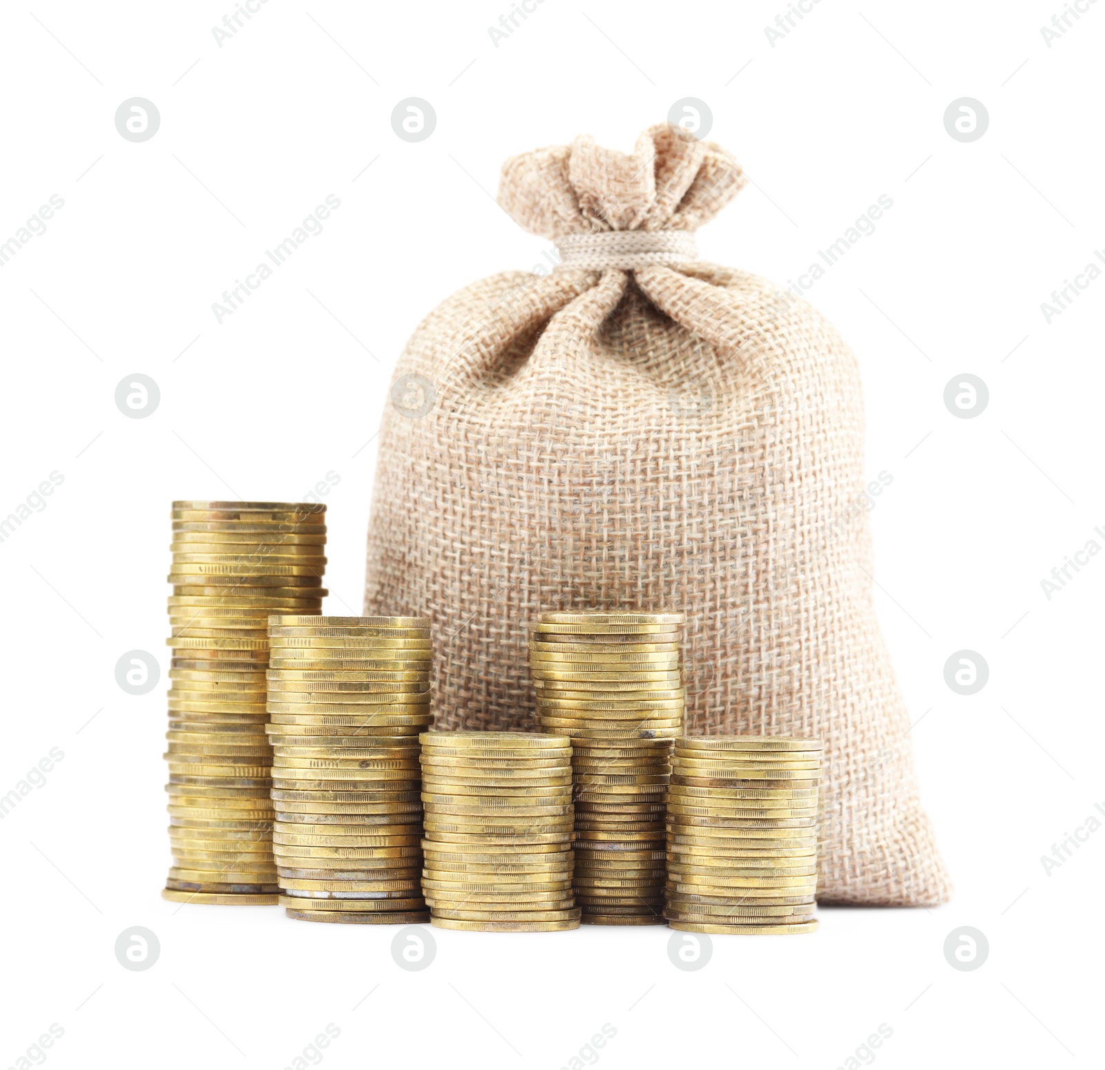 Bag and stacked coins isolated on white Photo of Bag and stacked coins isolated on white