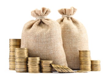 Photo of Bags and stacked coins isolated on white