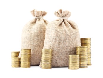 Photo of Bags and stacked coins isolated on white