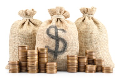 Photo of Bags with dollar sign and coins isolated on white