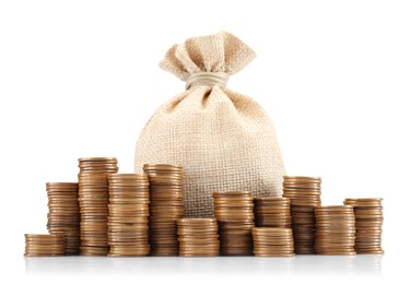 Photo of Bag and stacked coins isolated on white