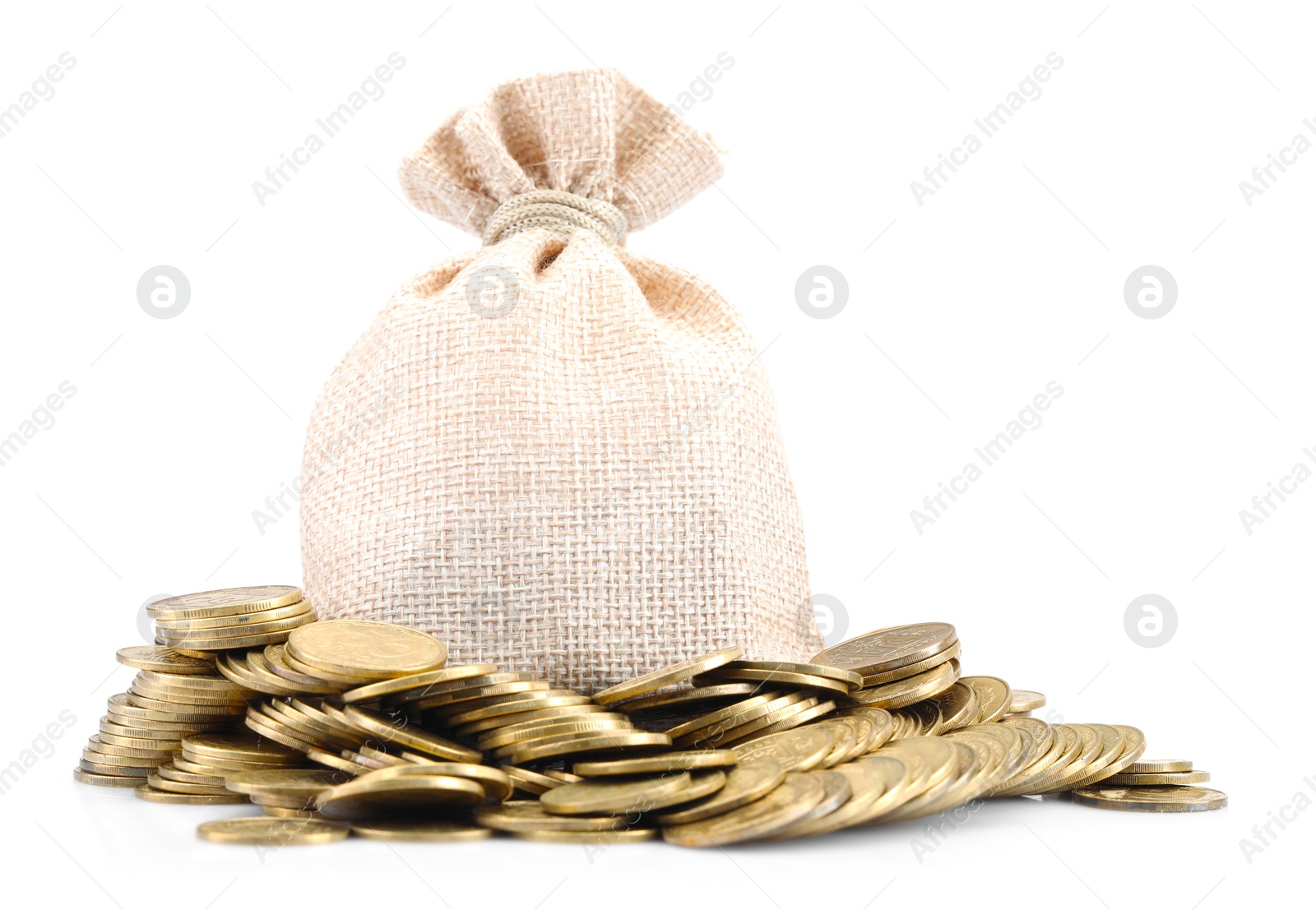 Bag and heap of coins isolated on white Photo of Bag and heap of coins isolated on white
