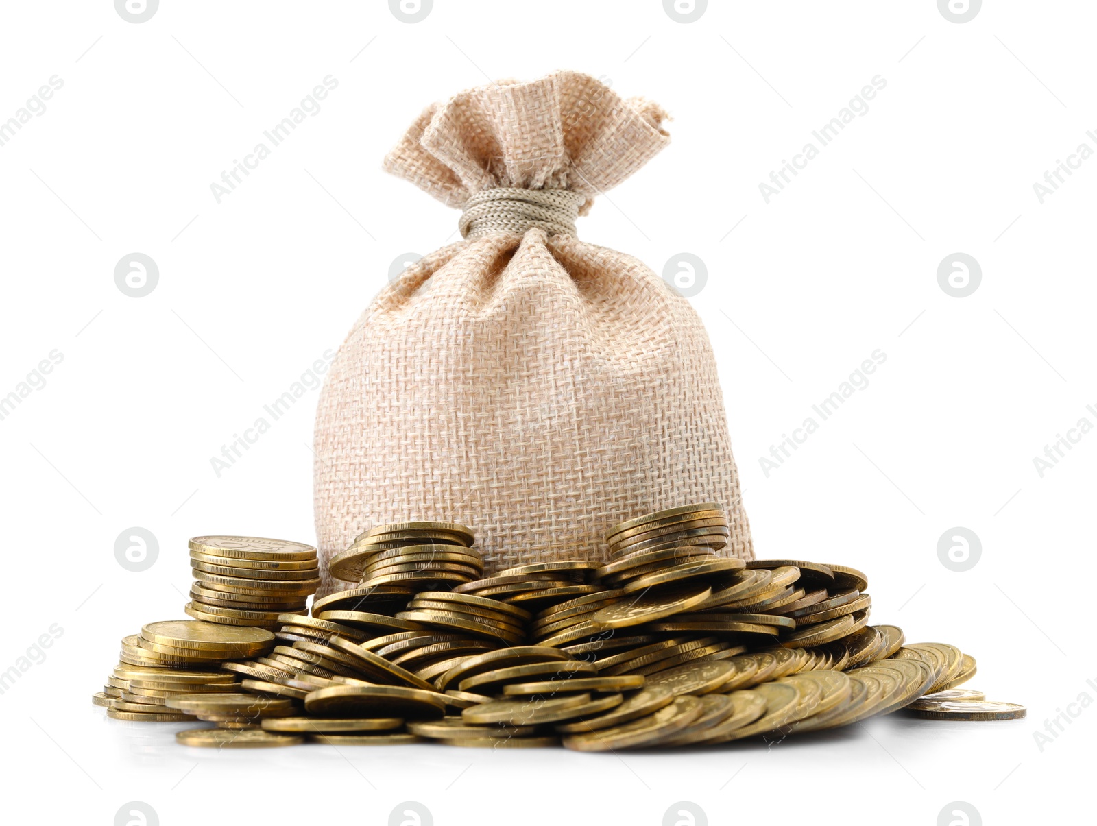 Bag and heap of coins isolated on white Photo of Bag and heap of coins isolated on white