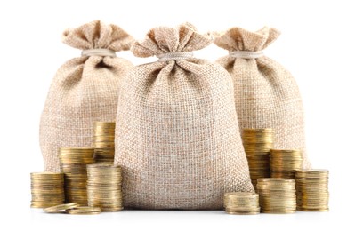 Photo of Bags and stacked coins isolated on white