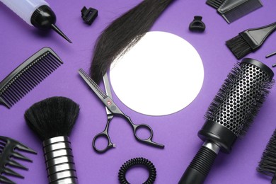 Photo of Different hairdresser's tools on purple background, above view