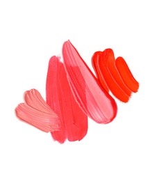 Photo of Samples of different lipsticks isolated on white, top view