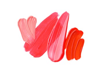 Photo of Samples of different lipsticks isolated on white, top view