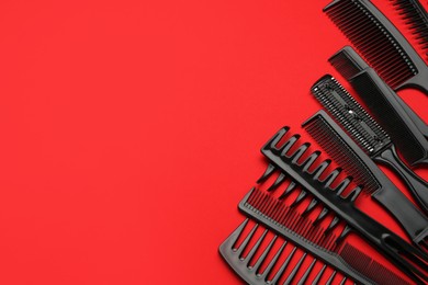 Photo of Different hairdresser's tools on red background, above view. Space for text