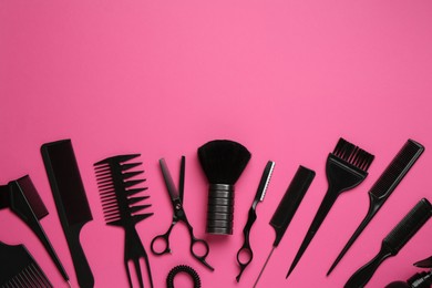 Photo of Different hairdresser's tools on pink background, flat lay. Space for text