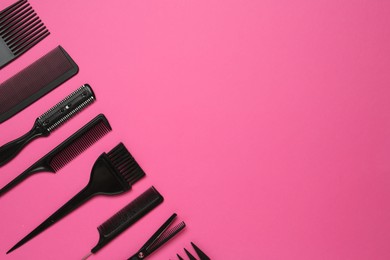 Photo of Different hairdresser's tools on pink background, flat lay. Space for text