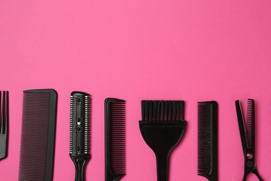 Photo of Different hairdresser's tools on pink background, flat lay. Space for text
