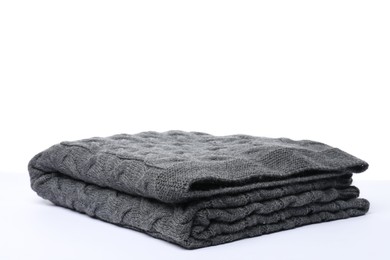 Photo of Folded grey woolen blanket on white background