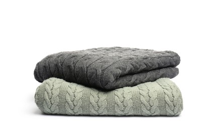 Photo of Two folded woolen blankets isolated on white