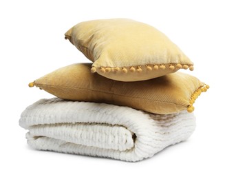 Photo of Folded woolen blanket and pillows isolated on white