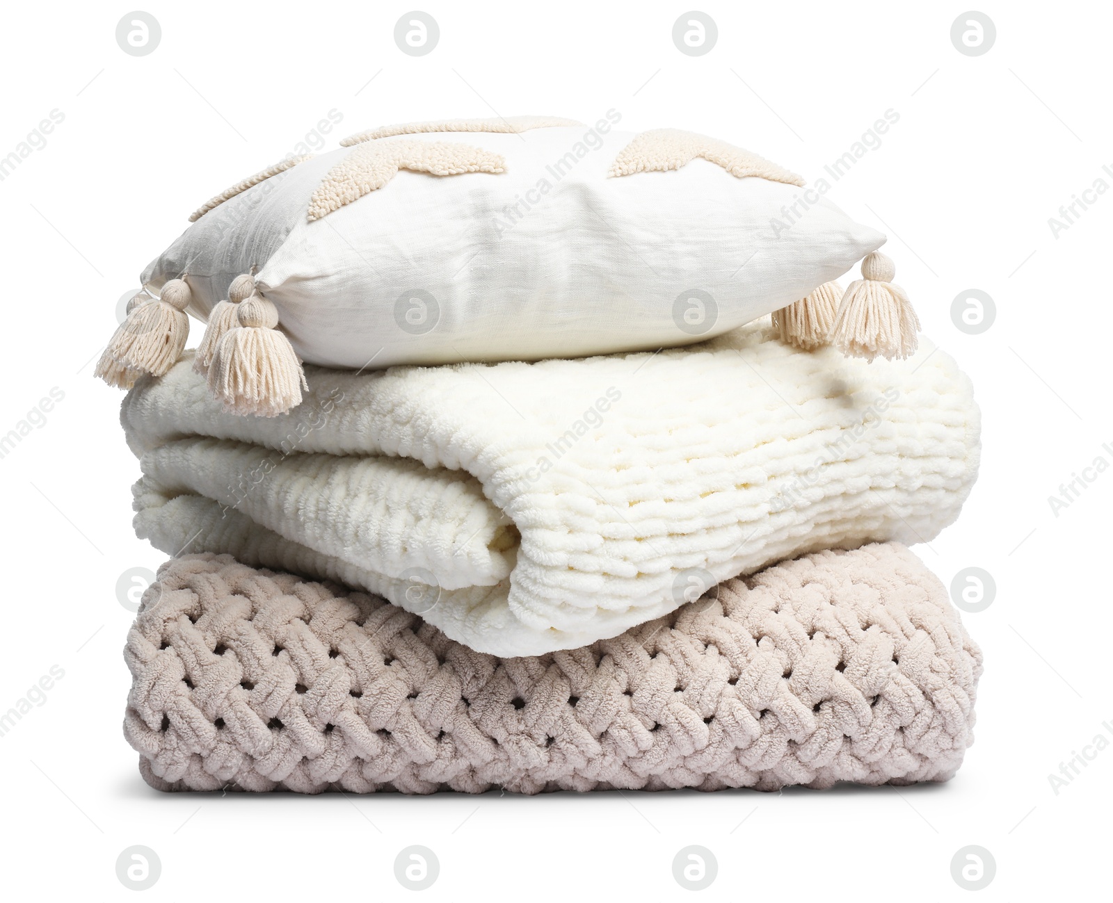 Folded woolen blankets and pillow isolated on white Photo of Folded woolen blankets and pillow isolated on white