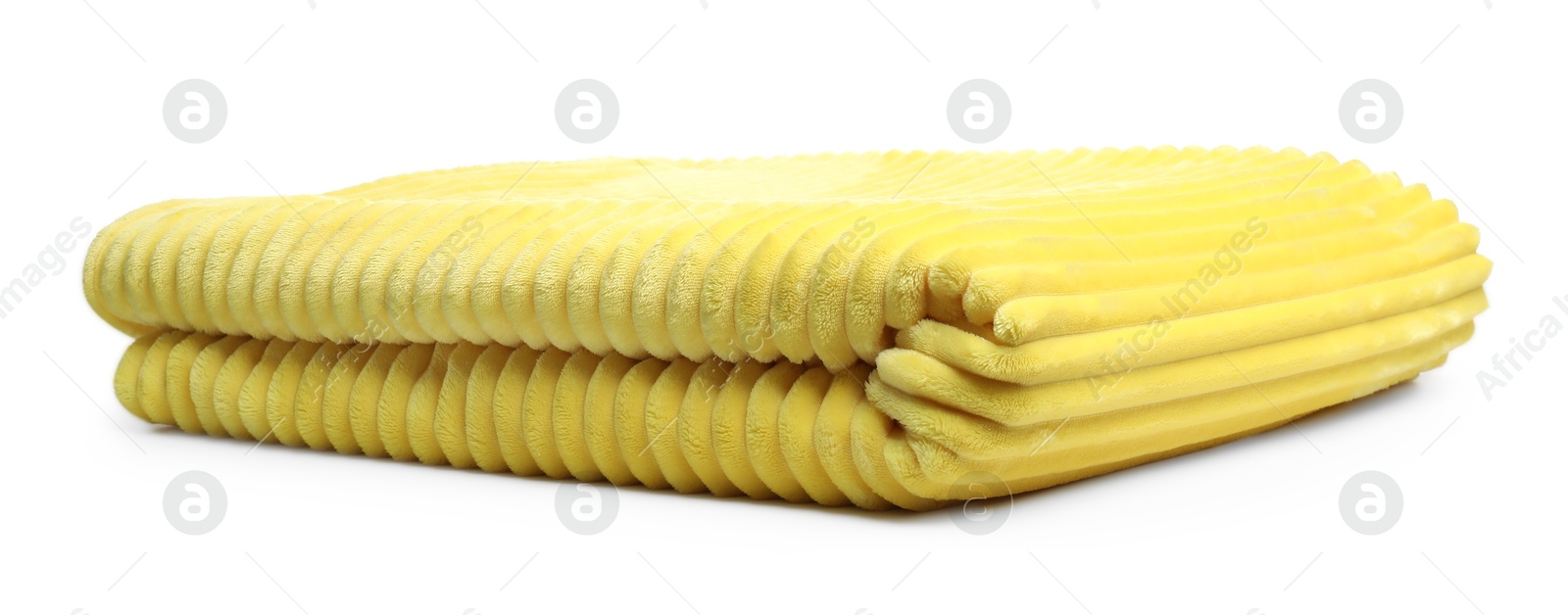 Folded yellow woolen blanket isolated on white Photo of Folded yellow woolen blanket isolated on white