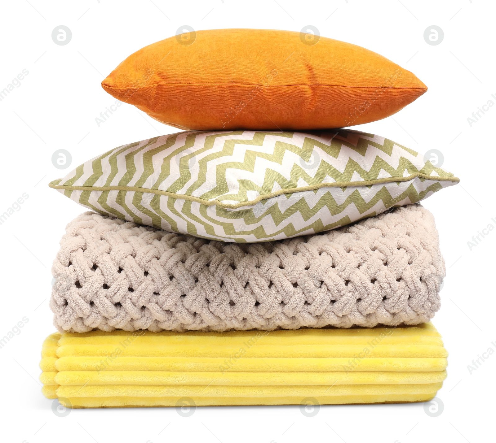 Folded woolen blankets and pillows isolated on white Photo of Folded woolen blankets and pillows isolated on white