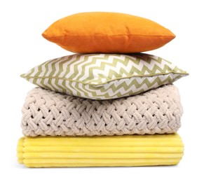 Photo of Folded woolen blankets and pillows isolated on white