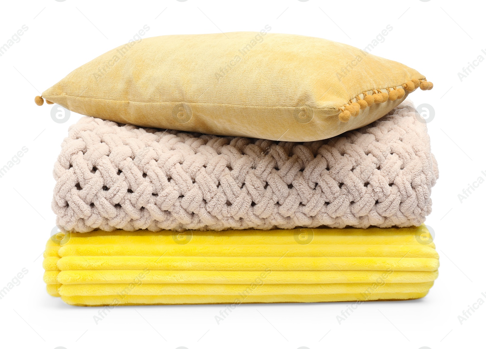 Folded woolen blankets and pillow isolated on white Photo of Folded woolen blankets and pillow isolated on white