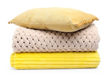 Photo of Folded woolen blankets and pillow isolated on white