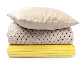 Photo of Folded woolen blankets and pillow isolated on white