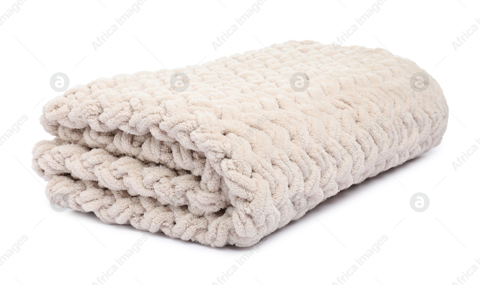Folded beige woolen blanket isolated on white Photo of Folded beige woolen blanket isolated on white