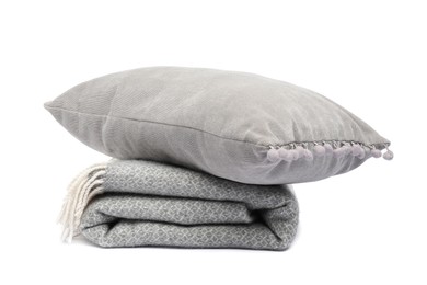 Photo of Folded woolen blanket and pillow isolated on white
