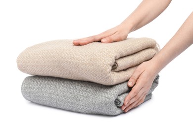 Photo of Woman with folded blankets on white background, closeup