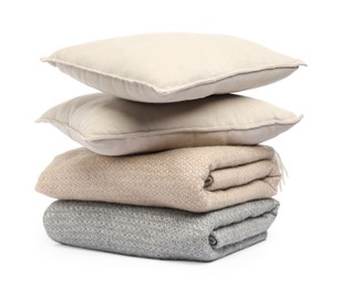 Photo of Folded woolen blankets and pillow isolated on white