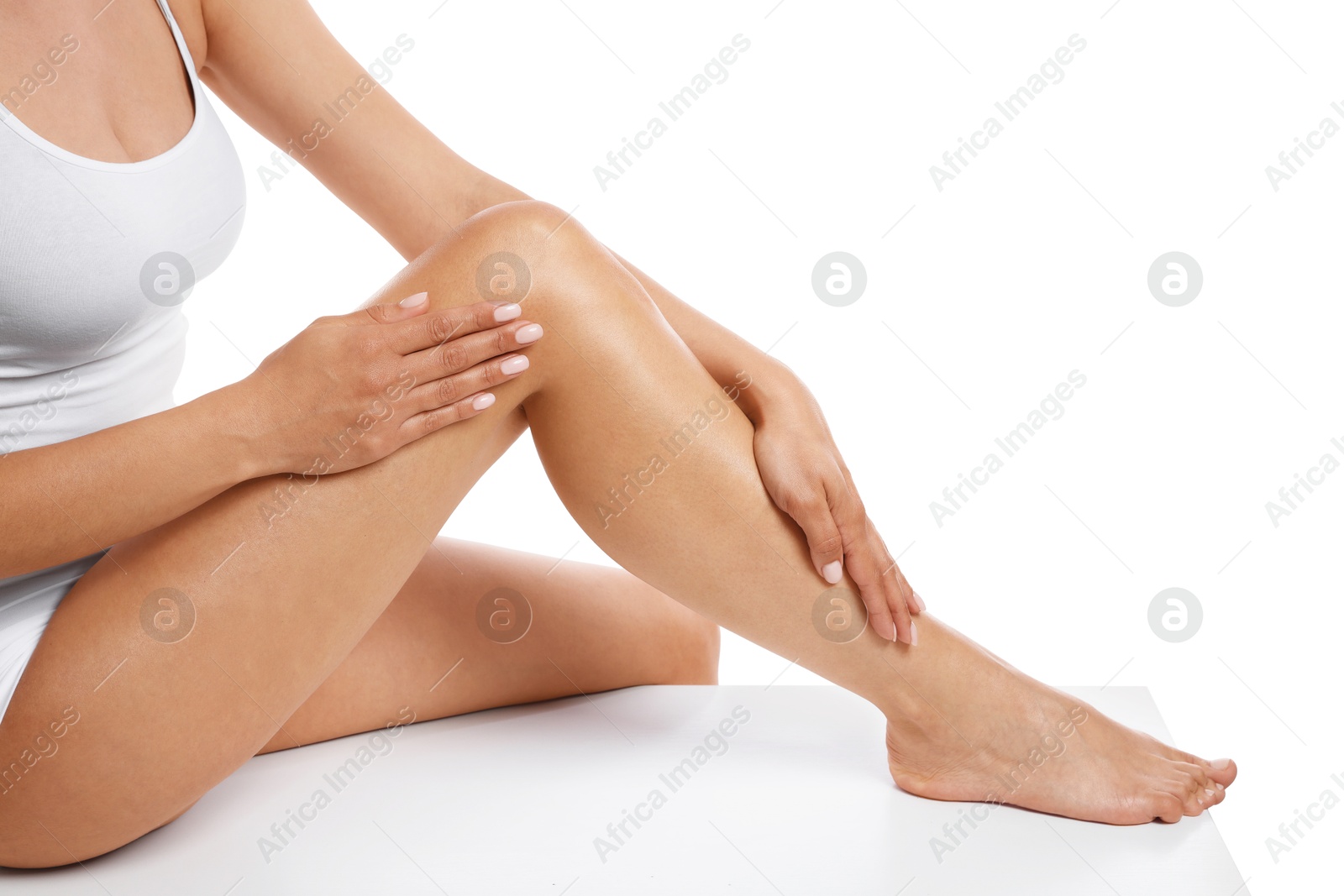 Woman with beautiful smooth legs after epilation on white background, closeup Photo of Woman with beautiful smooth legs after epilation on white background, closeup