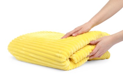 Photo of Woman with folded yellow blanket on white background, closeup