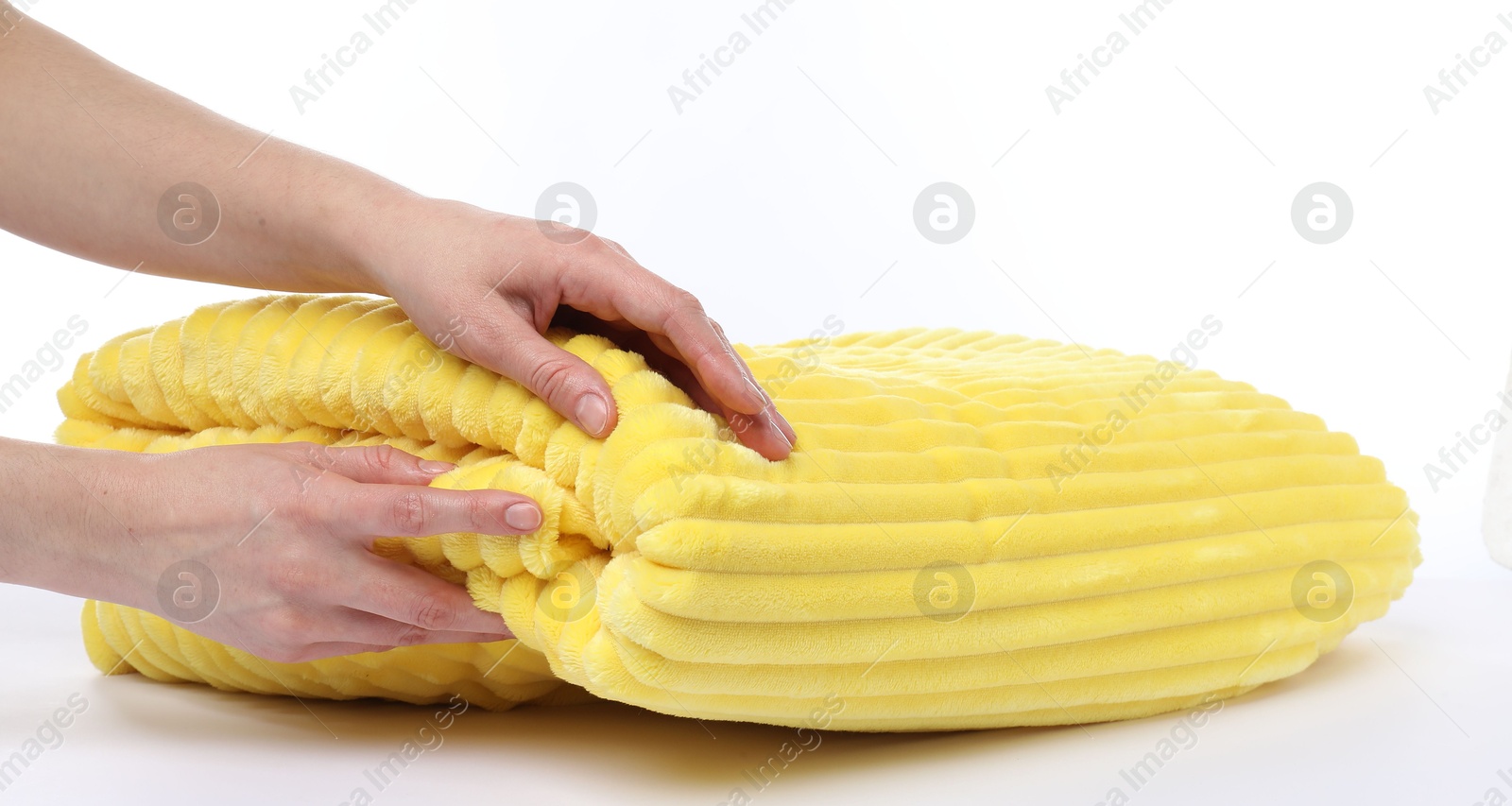 Woman with folded yellow blanket on white background, closeup Photo of Woman with folded yellow blanket on white background, closeup