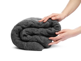 Photo of Woman with folded grey blanket on white background, closeup