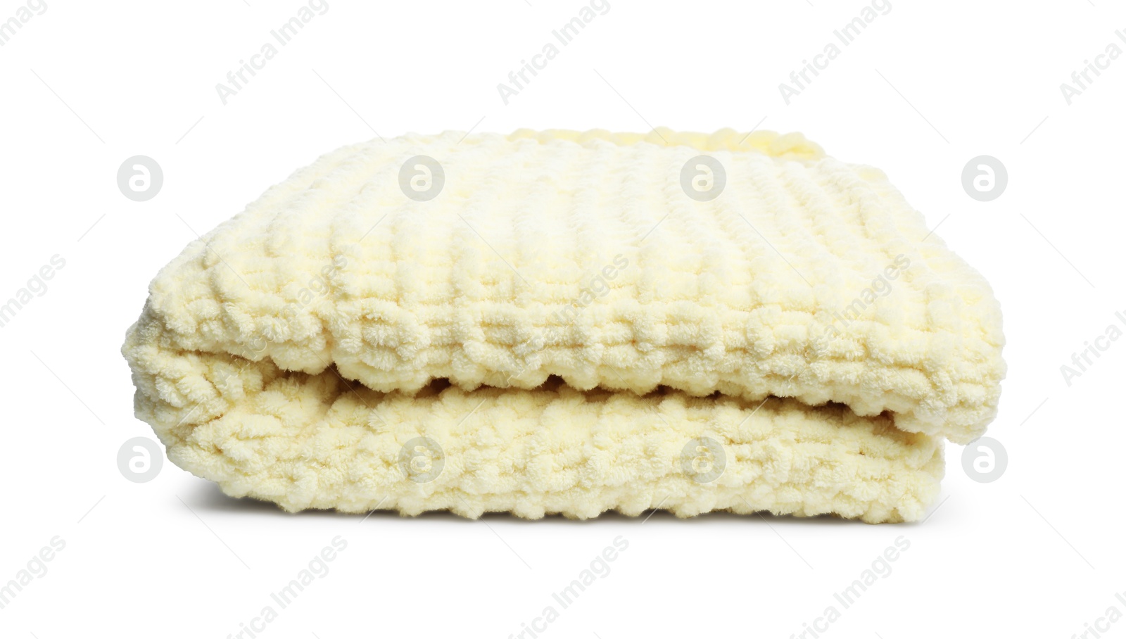 Folded pale yellow woolen blanket isolated on white Photo of Folded pale yellow woolen blanket isolated on white
