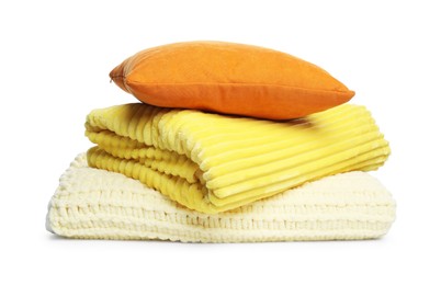Photo of Folded woolen blankets and pillow isolated on white