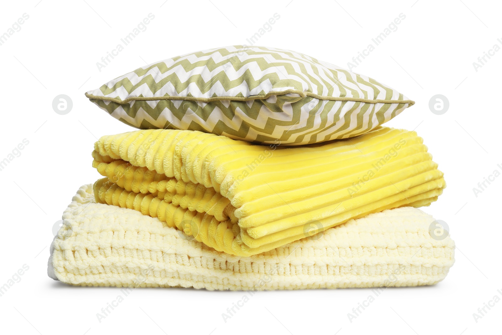 Folded woolen blankets and pillow isolated on white Photo of Folded woolen blankets and pillow isolated on white