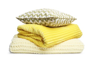 Photo of Folded woolen blankets and pillow isolated on white