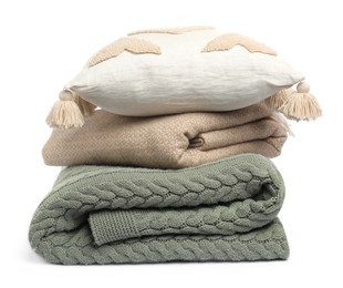 Photo of Folded woolen blankets and pillow isolated on white