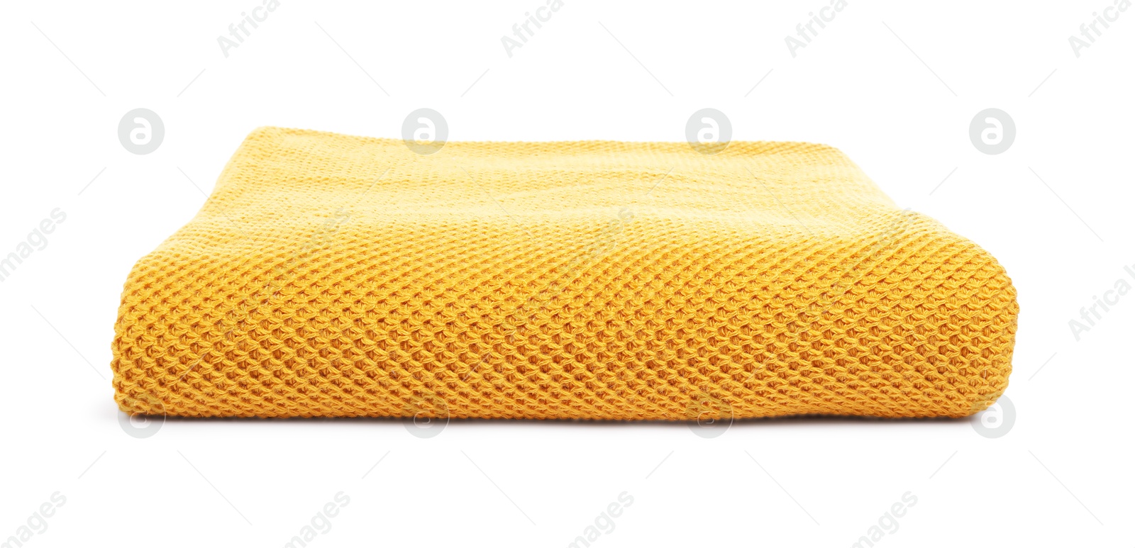 Folded orange woolen blanket isolated on white Photo of Folded orange woolen blanket isolated on white