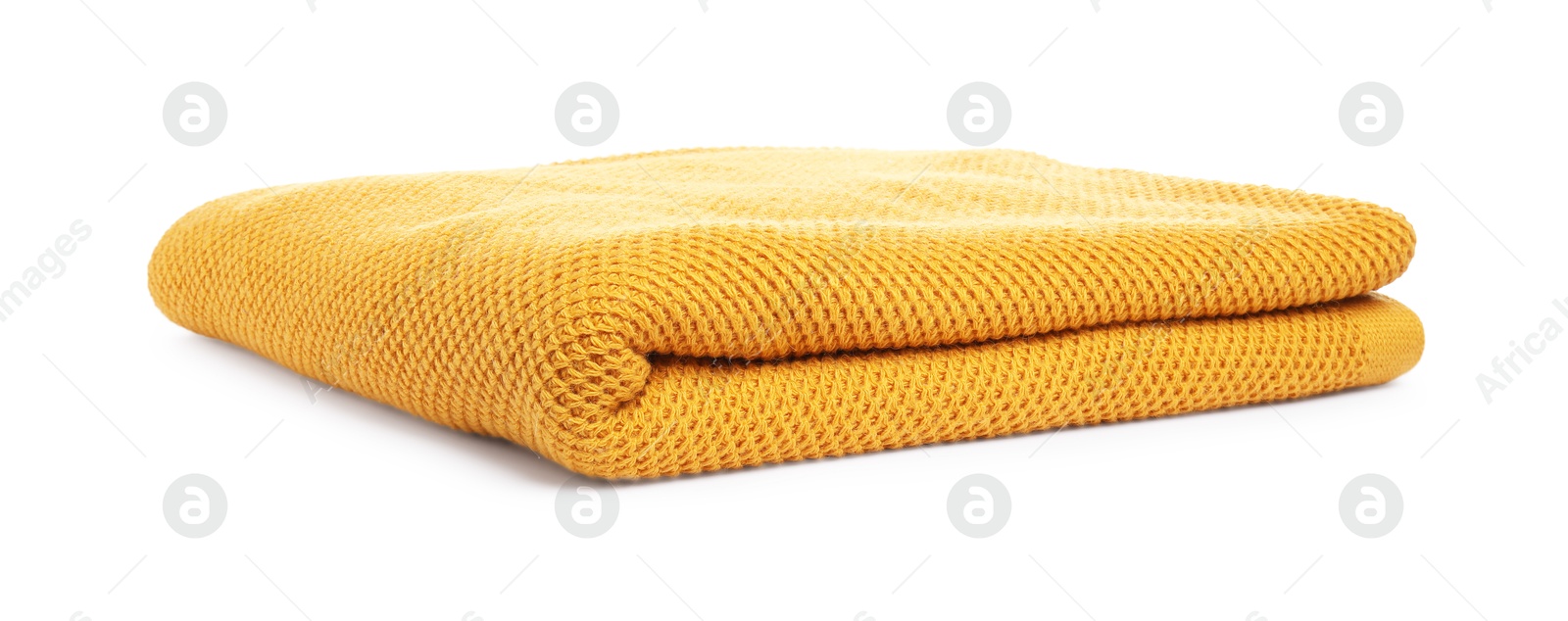 Folded orange woolen blanket isolated on white Photo of Folded orange woolen blanket isolated on white
