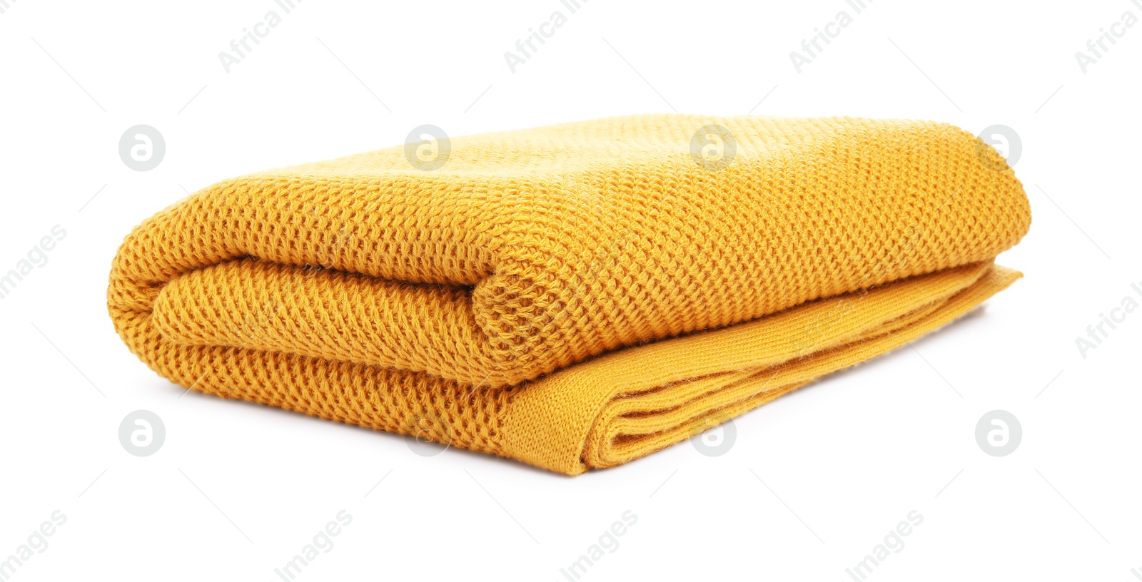 Folded orange woolen blanket isolated on white Photo of Folded orange woolen blanket isolated on white