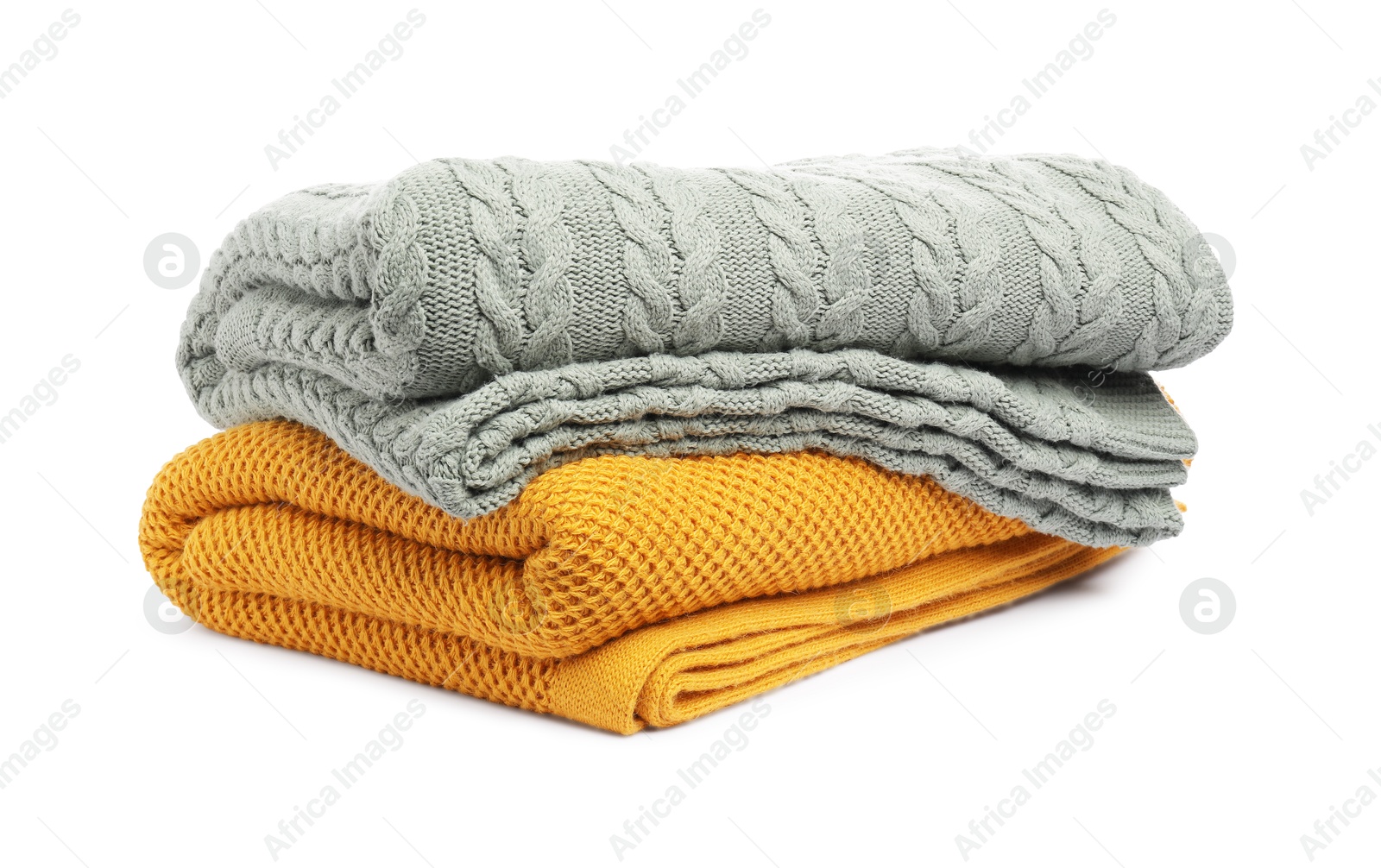 Two folded woolen blankets isolated on white Photo of Two folded woolen blankets isolated on white