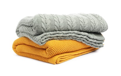 Photo of Two folded woolen blankets isolated on white