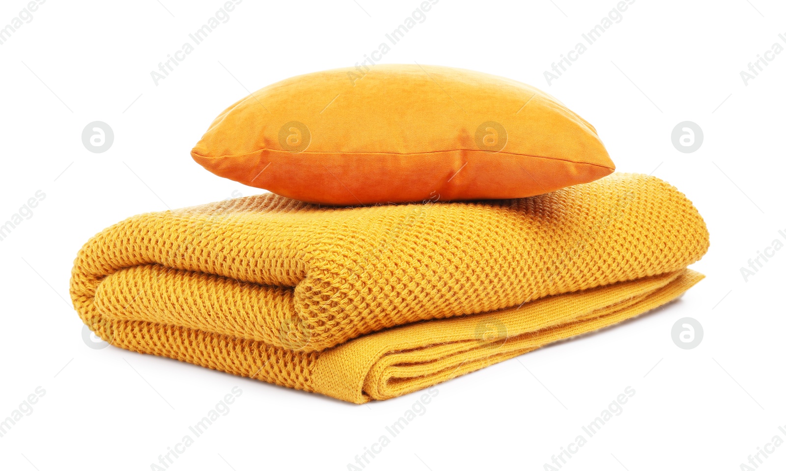 Folded woolen blanket and pillow isolated on white Photo of Folded woolen blanket and pillow isolated on white